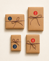 Four kraft-wrapped, hand-numbered parcels from The Navigator, the screen-free airplane activity box for ages 6 to 8